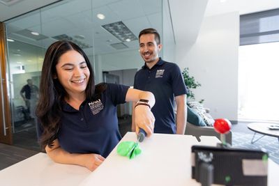 Two students work in a lab at the Phoenix Bioscience Core.