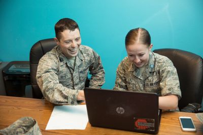 Army ROTC veteran students work on a laptop.