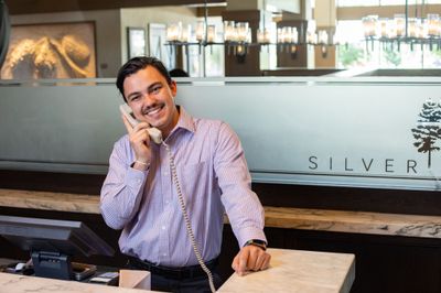 An NAU Hotel and Restaurant Management student trains while working the front desk at Silver Pines, a high-end restaurant in Flagstaff.