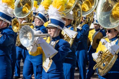NAU band members dressed in uniforms playing instruments.