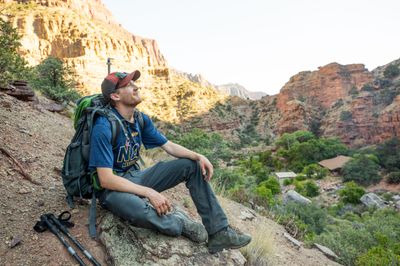 An NAU sustainability student smiles while taking a break between research at the Grand Canyon.